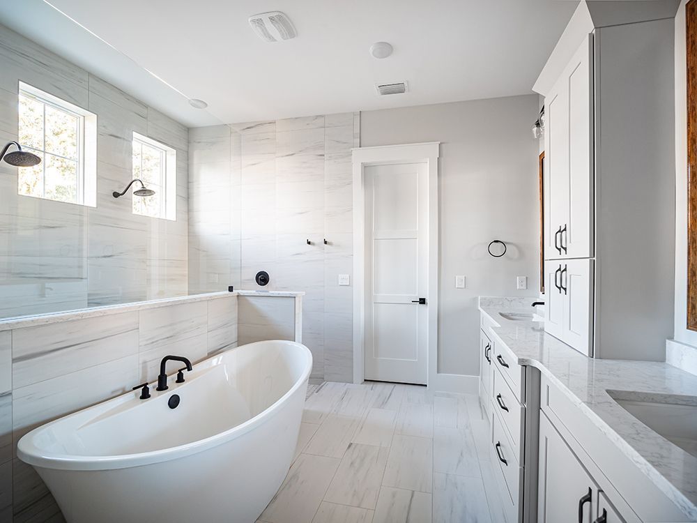 There is a bathtub in the middle of the bathroom.