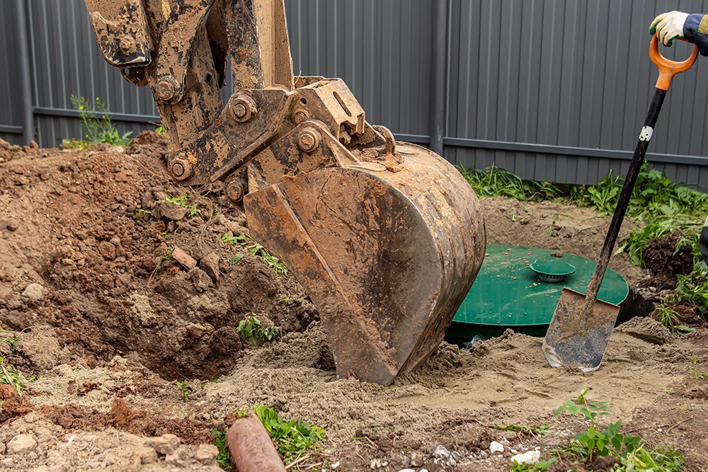 A person is using a shovel to dig a hole in the ground.