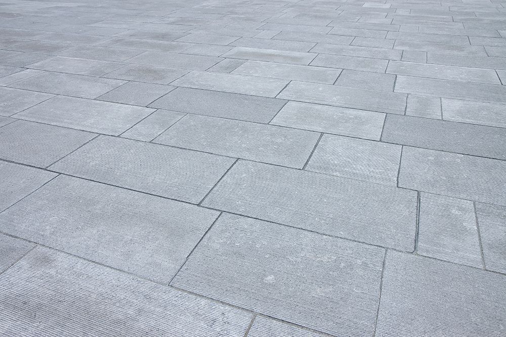 A close up of a gray tiled floor.