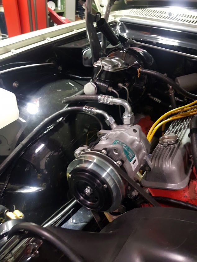 A Close Up Of A Car Engine With A Compressor — Airborne Auto Air in Gorokan, NSW