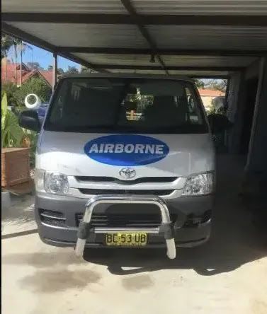 A White Van With The Word Airborne On The Front Is Parked In A Garage — Airborne Auto Air in Killarney Vale, NSW