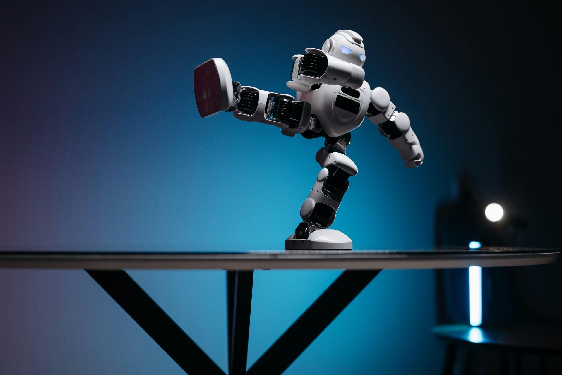 A robot is standing on top of a table.