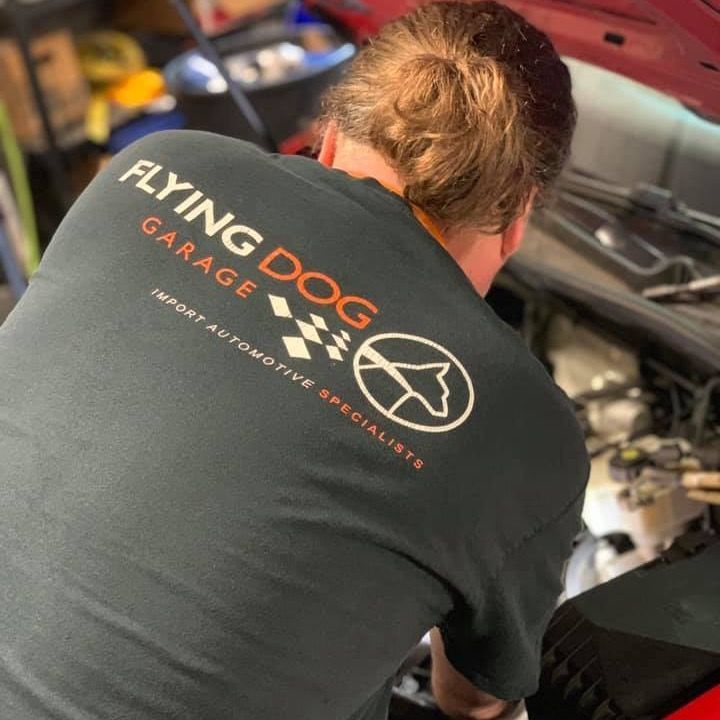 Team Member Working on Car Engine | Flying Dog Garage