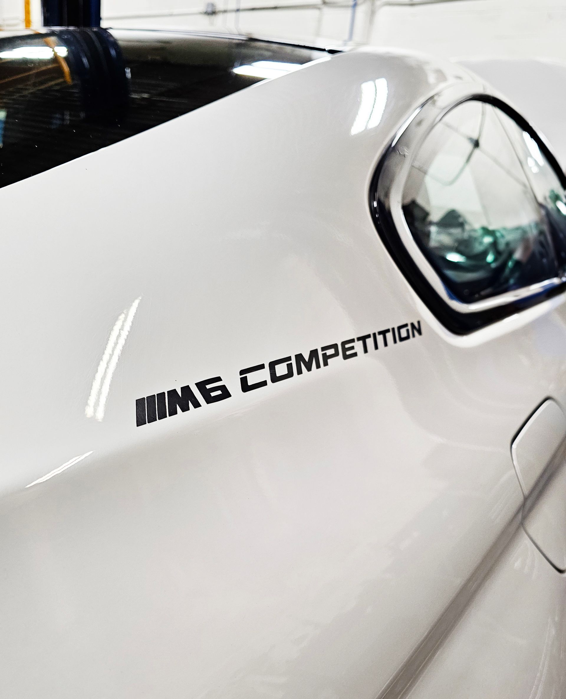 White BMW M6 Competition Car's Side Panel | Flying Dog Garage
