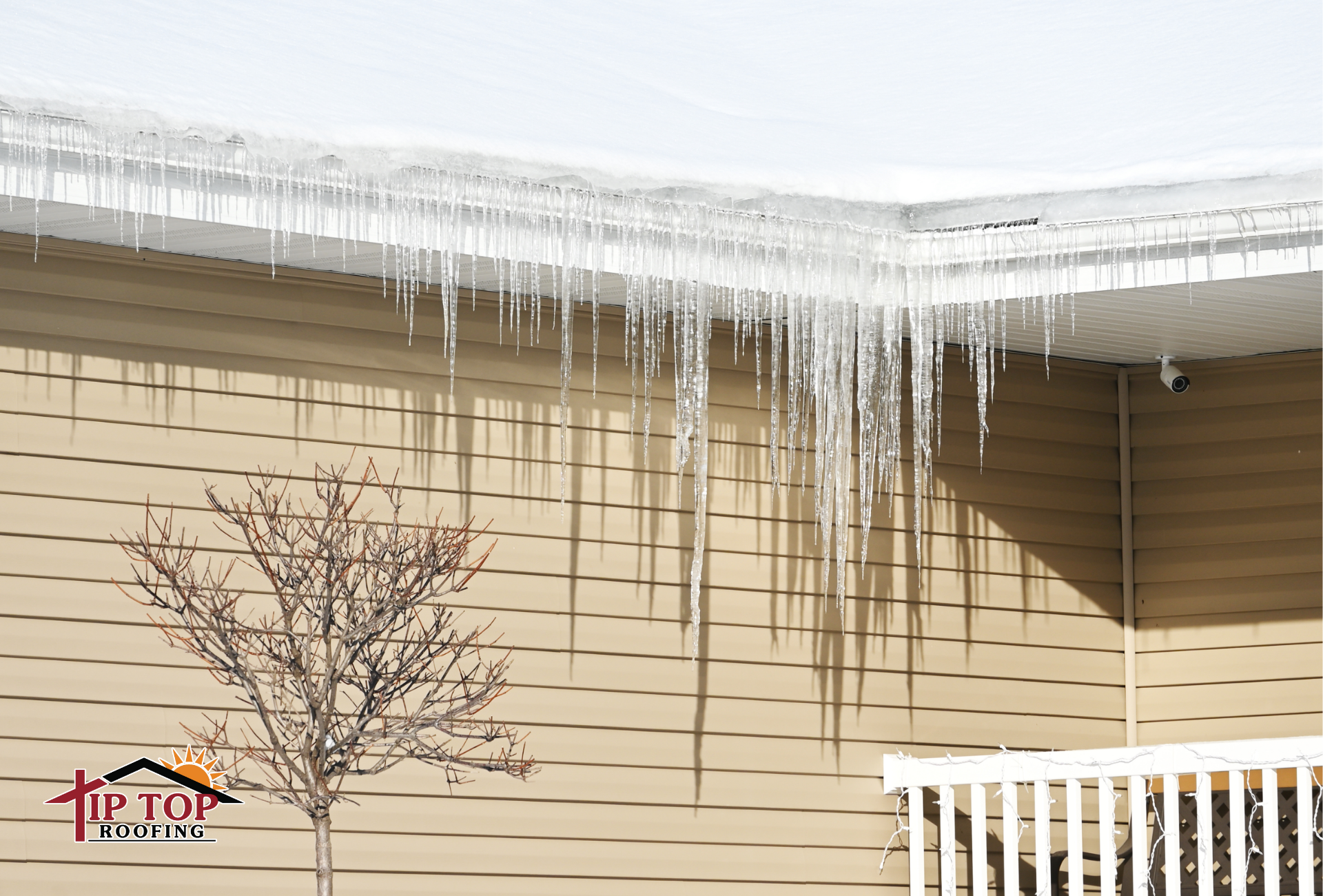 Snow and ice build up on the roof of a home