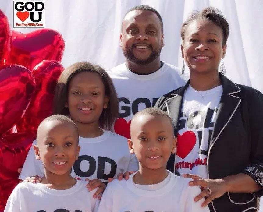 A family posing for a picture wearing god loves you shirts
