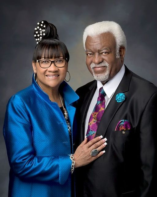 A man and a woman are posing for a picture together