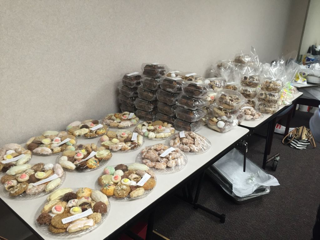 Tables filled with assorted cookies and baked goods.