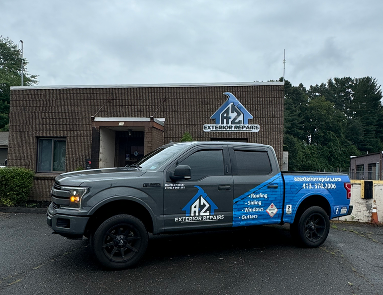 A-Z Exterior Repairs business truck parked in front of the A-Z Exterior Repairs office.