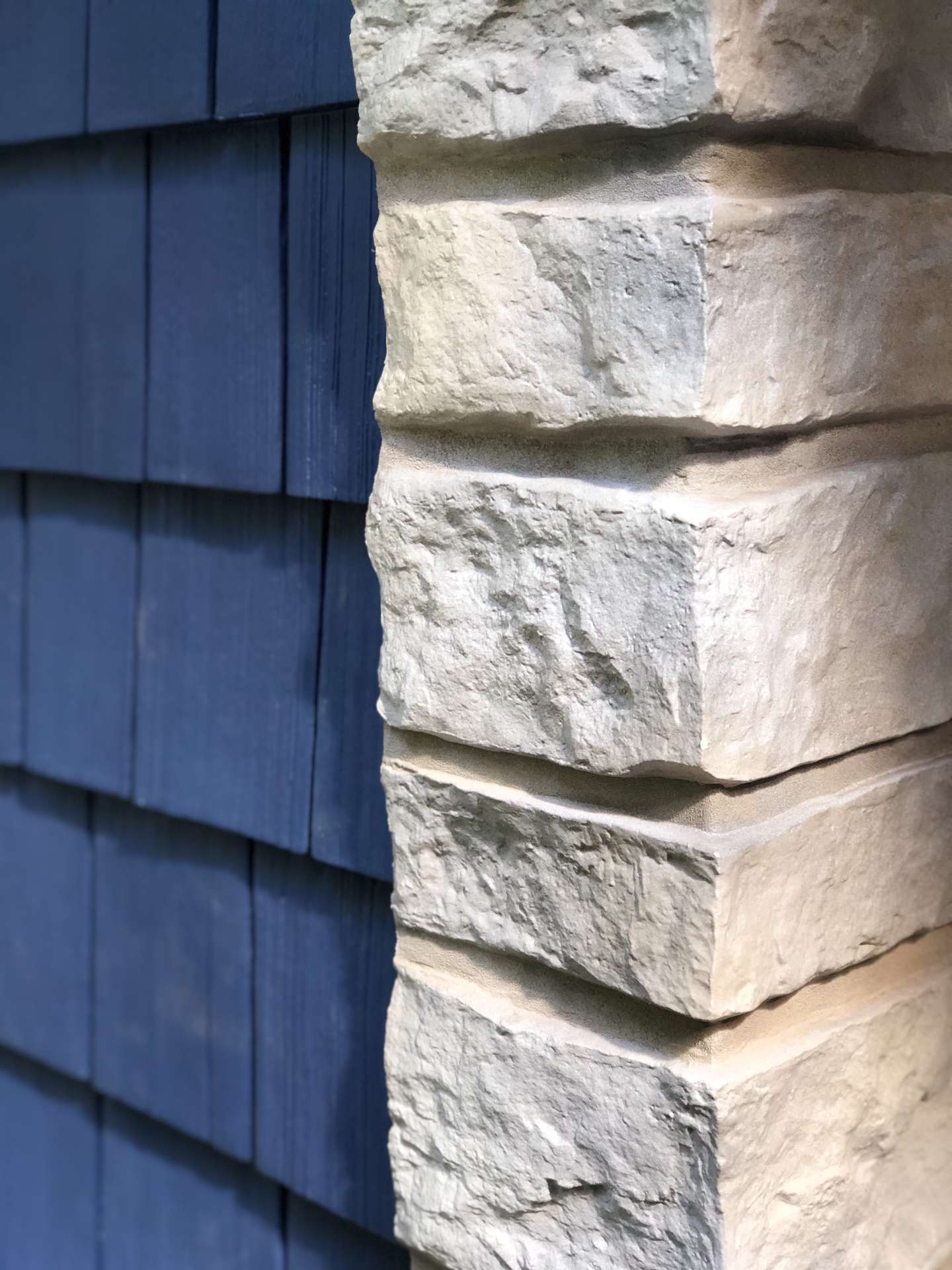 Beautiful vinyl tando stone pillar siding installed for customer home in Blandford, MA