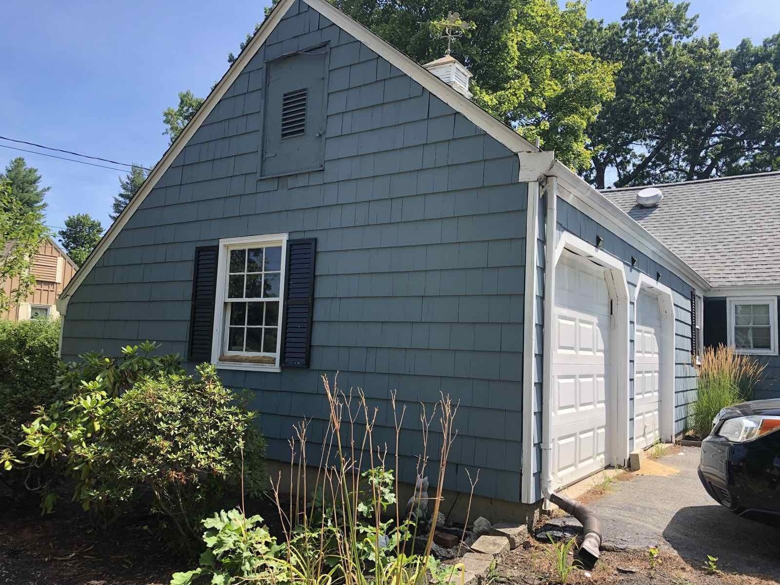 Baby blue wooden shake siding to be replaced with new baby blue horizontal vinyl siding.