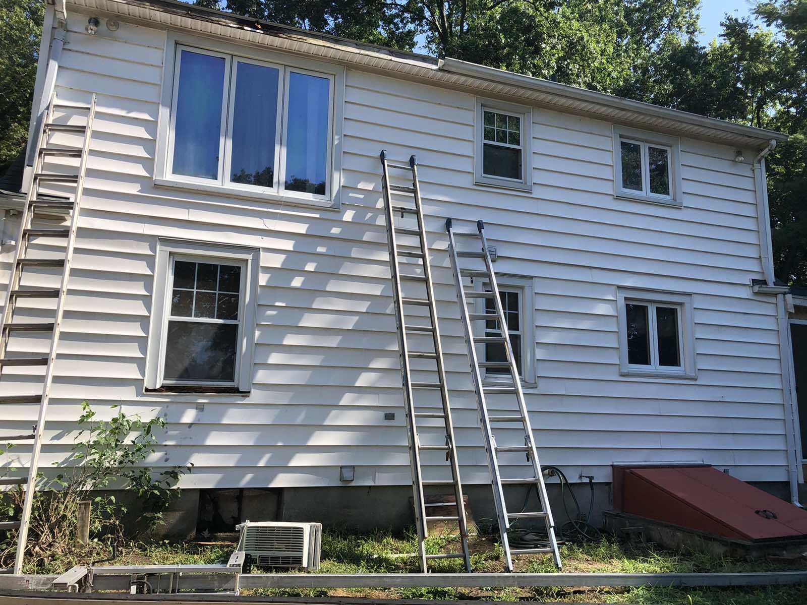 Weathered aluminum siding from the New England weather. Ready to be replaced with new vinyl siding.