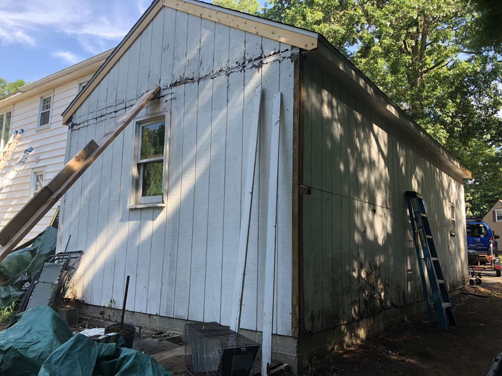 Weathered aluminum siding from the New England weather. Ready to be replaced with new vinyl siding.