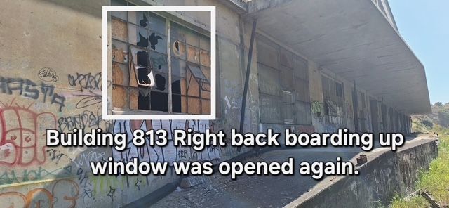 A dilapidated building with graffiti and a boarded-up window, now opened, captioned 