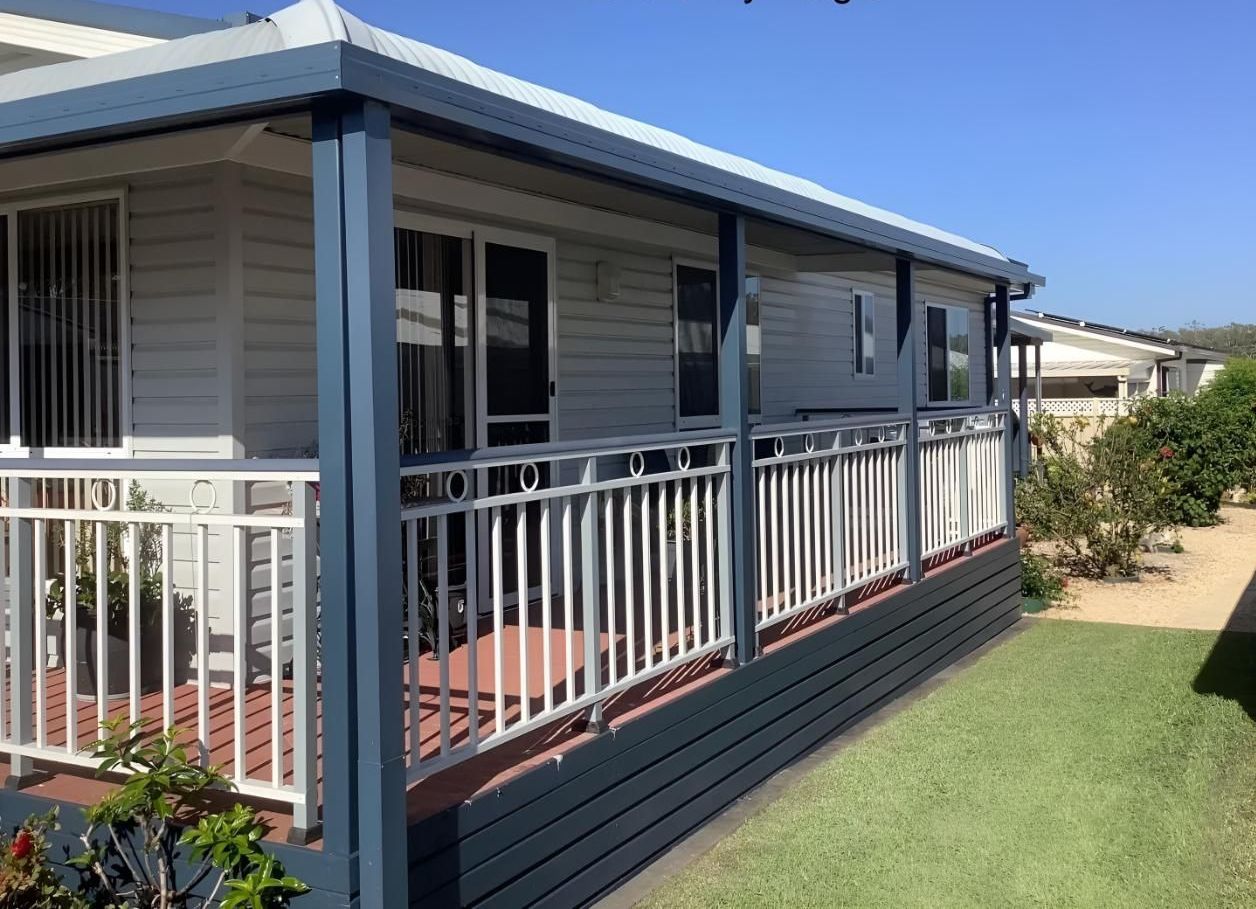 A Picture of a Porch With the Words Before My Magic Written on It — Port Blinds & Awnings In Port Macquarie, NSW