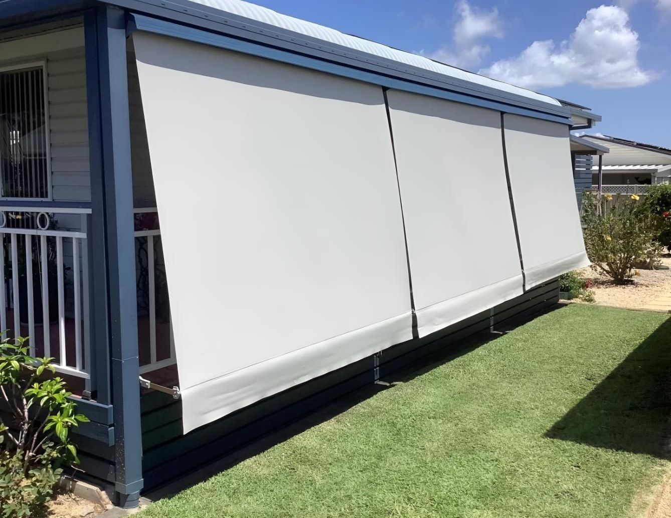 A Picture of a Porch With the Words Before My Magic Written on It — Port Blinds & Awnings In Port Macquarie, NSW