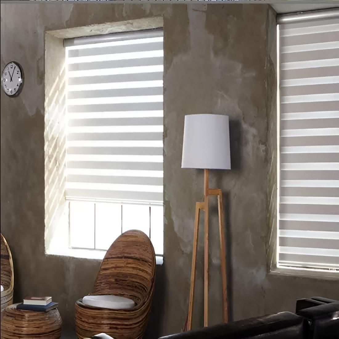 A Living Room With a Chair a Lamp and a Clock on the Wall — Port Blinds & Awnings In Port Macquarie, NSW