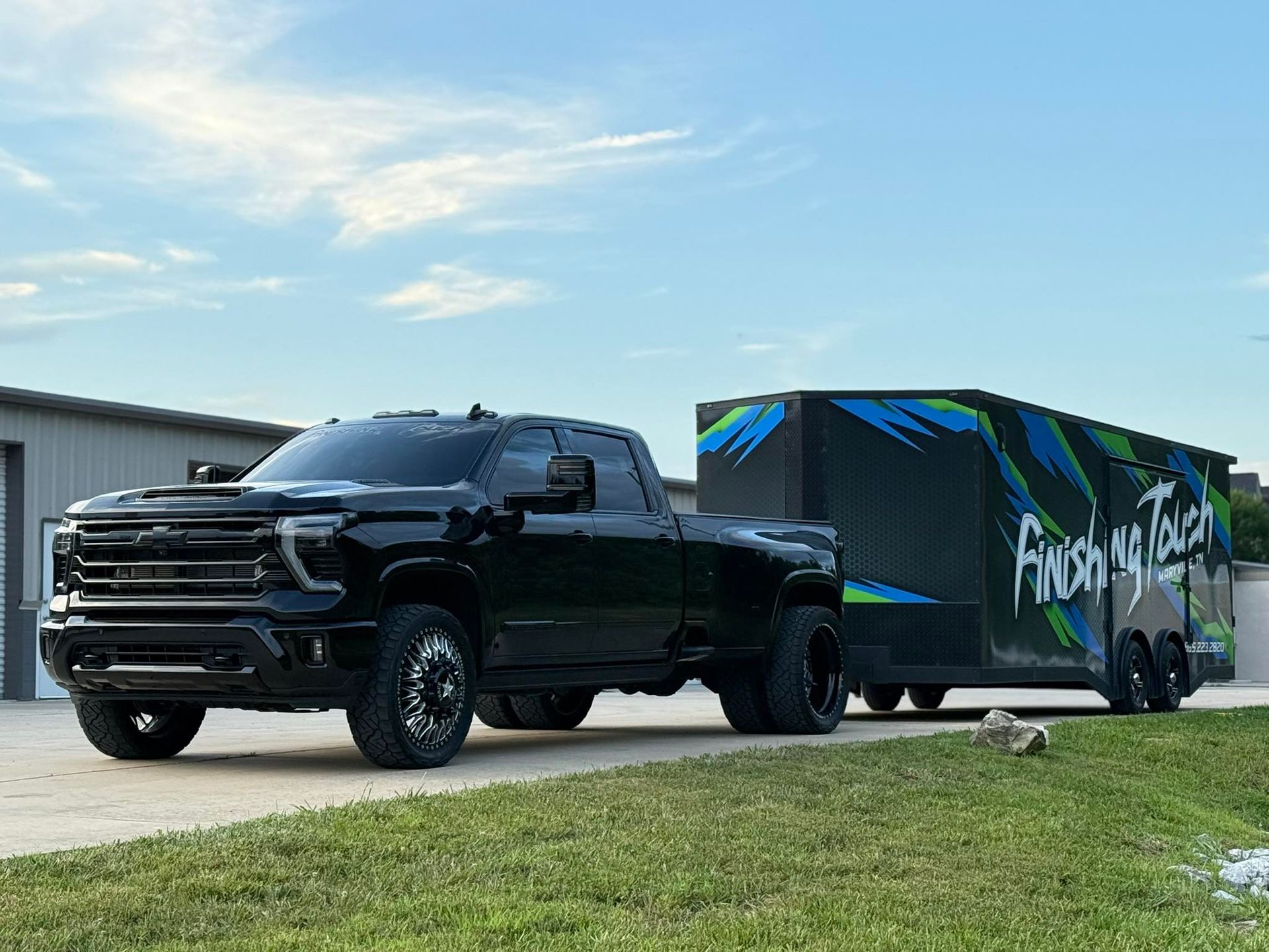 A bunch of cars are parked in a garage.