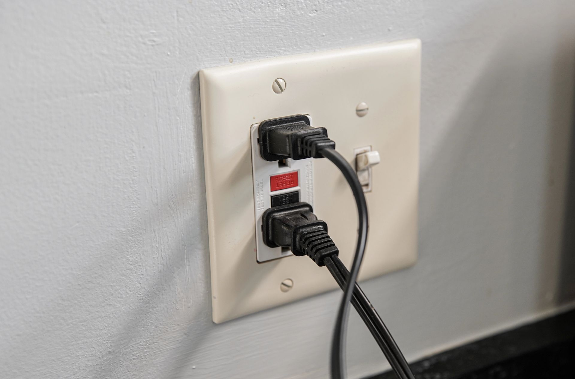 GFCI outlet with two cords plugged in