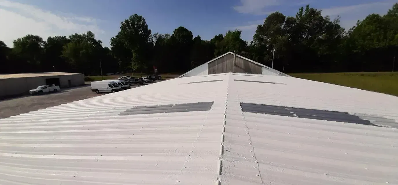 The roof of a building is covered in white paint.