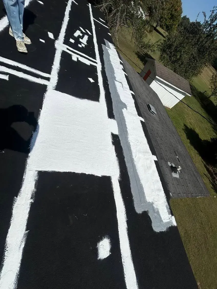 A person is walking down a street with white lines