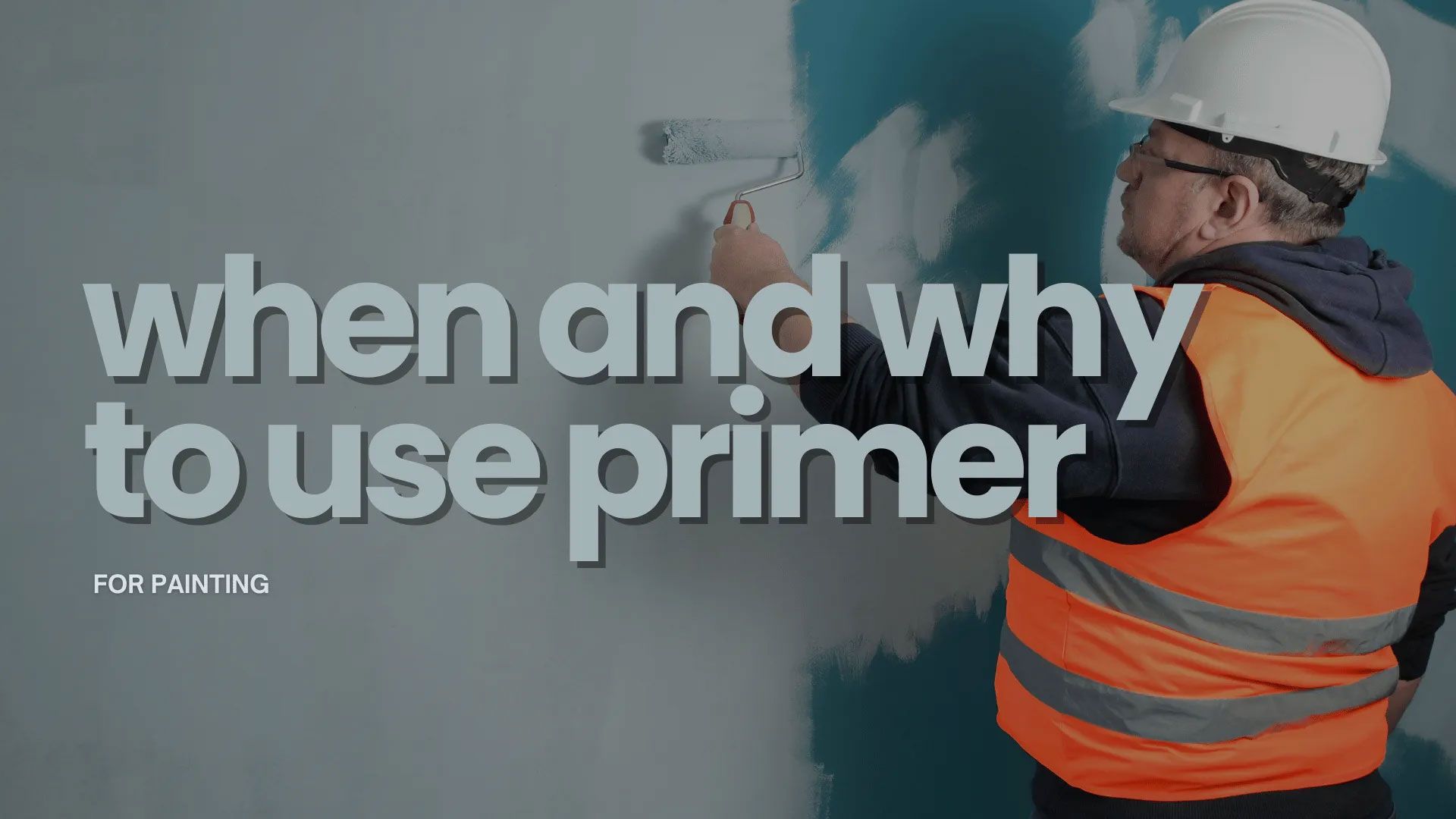 Man in safety gear painting a wall with a roller, text: