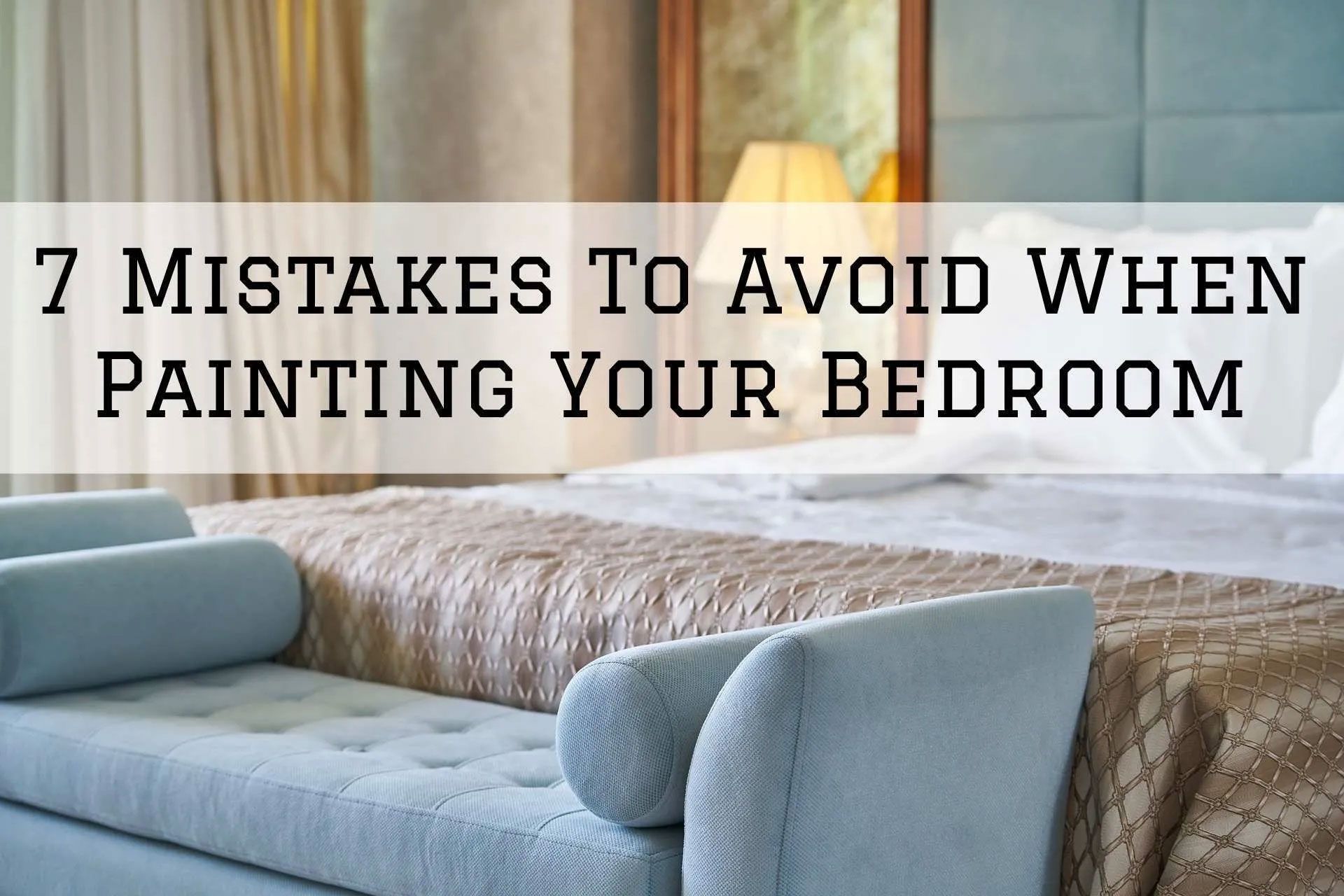 Bedroom with a light-colored bed, bench, and the text 