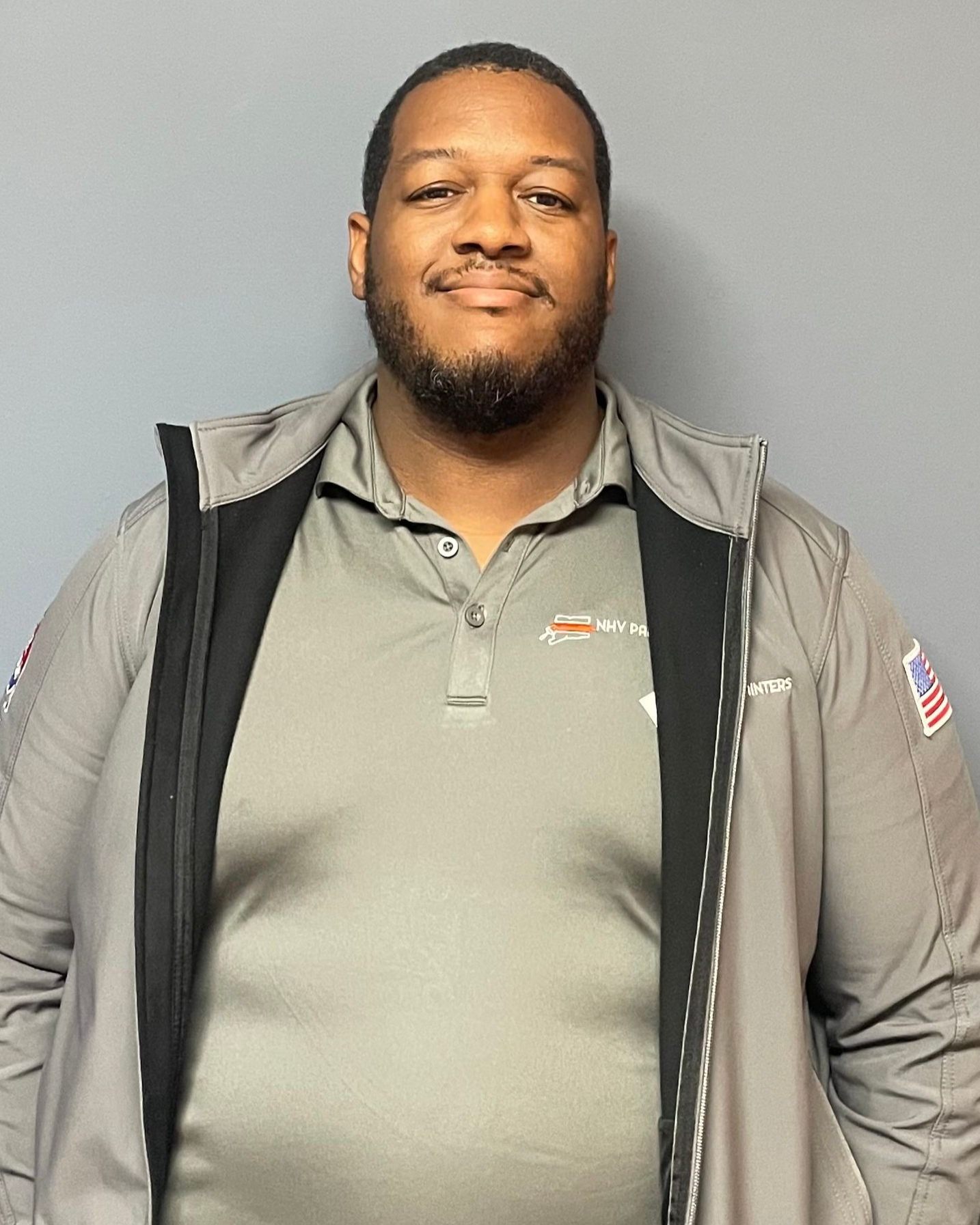A portrait of Christopher Walley, Project Coordinator at NHV Painters.