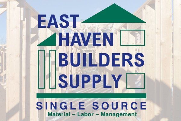 Logo for East Haven Builders Supply: text and house outline in teal over a wooden frame backdrop.