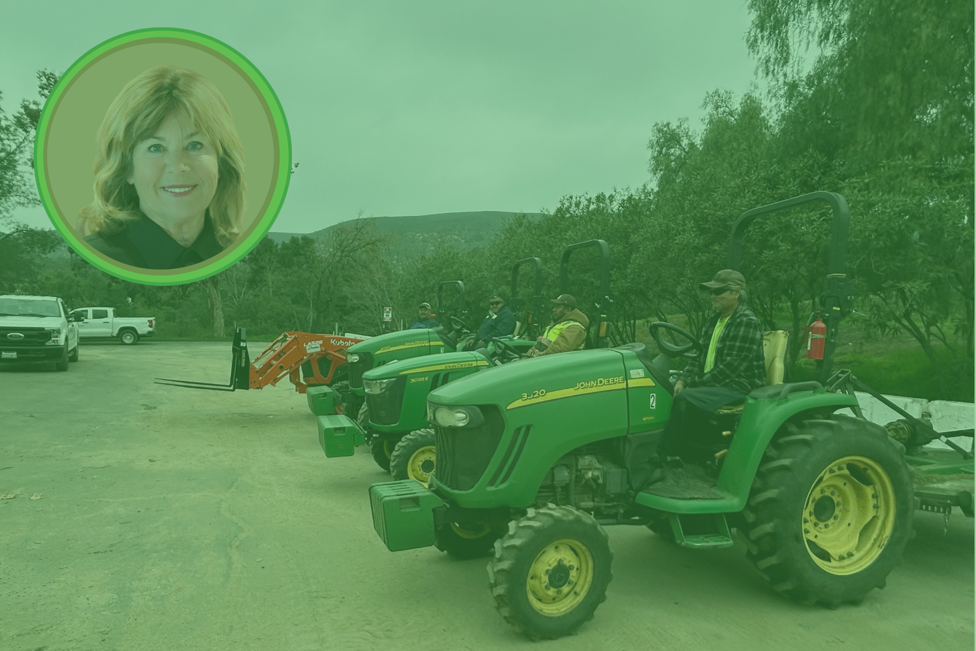 line of green tractors and drivers prepared to do trail maintenance