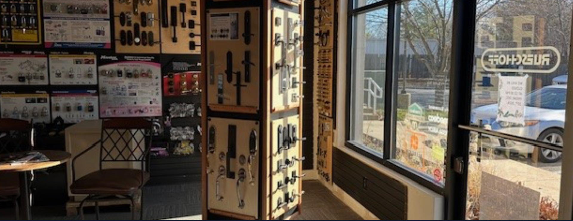 Interior of Rueschhoff Locksmiths showroom with floor models of door locks.