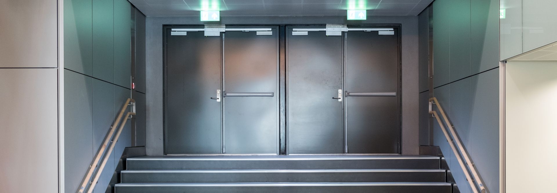 Metal commercial doors that are shiny and sturdy.