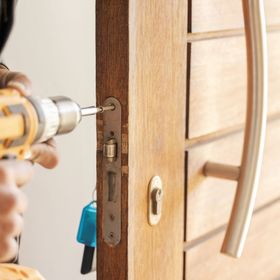 Image of a locking being installed at a person's home.