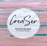 La palabra crear está escrita en cursiva sobre un fondo blanco.