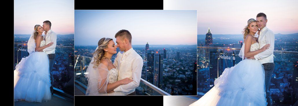 Eine Braut und ein Bräutigam stehen auf einem Gebäude mit Blick auf eine Stadt.