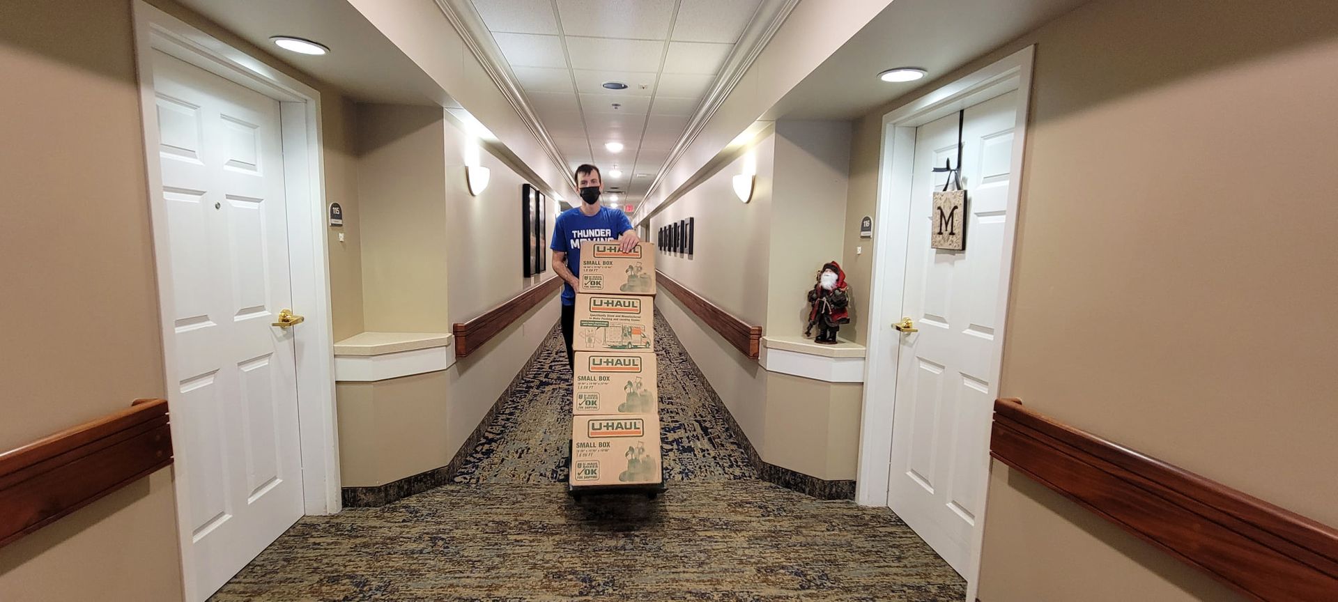 A man and two women are posing for a picture in front of a tent.