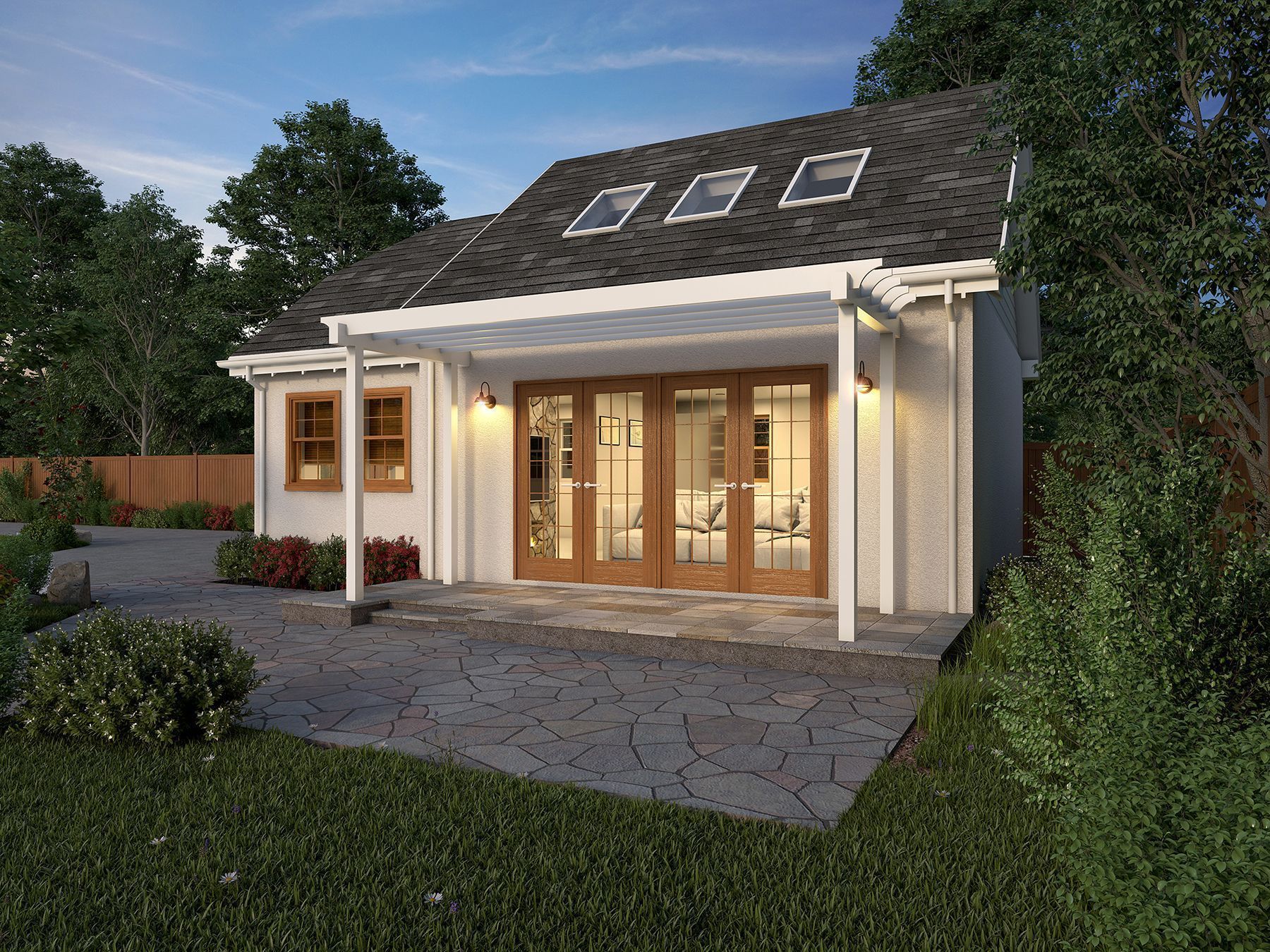 Small white building with open French doors, patio, and a green lawn.