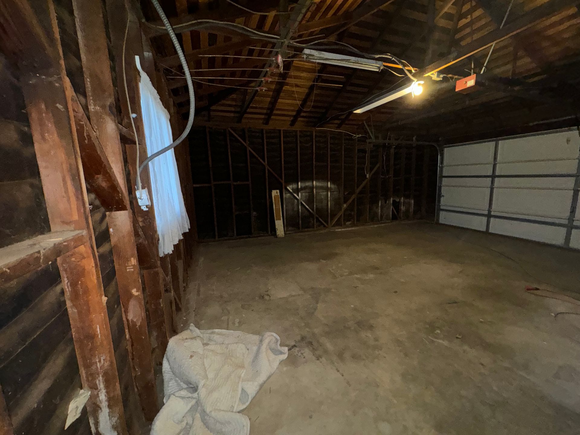 An empty old two car garage.