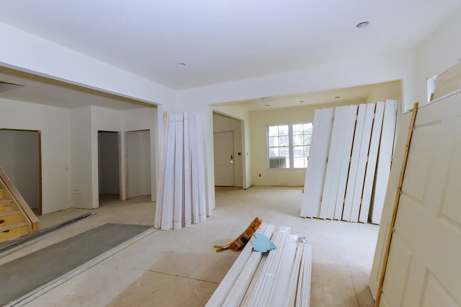 A room with a lot of white boards on the floor.