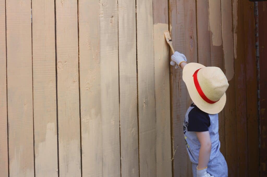 Exterior painting of a fence