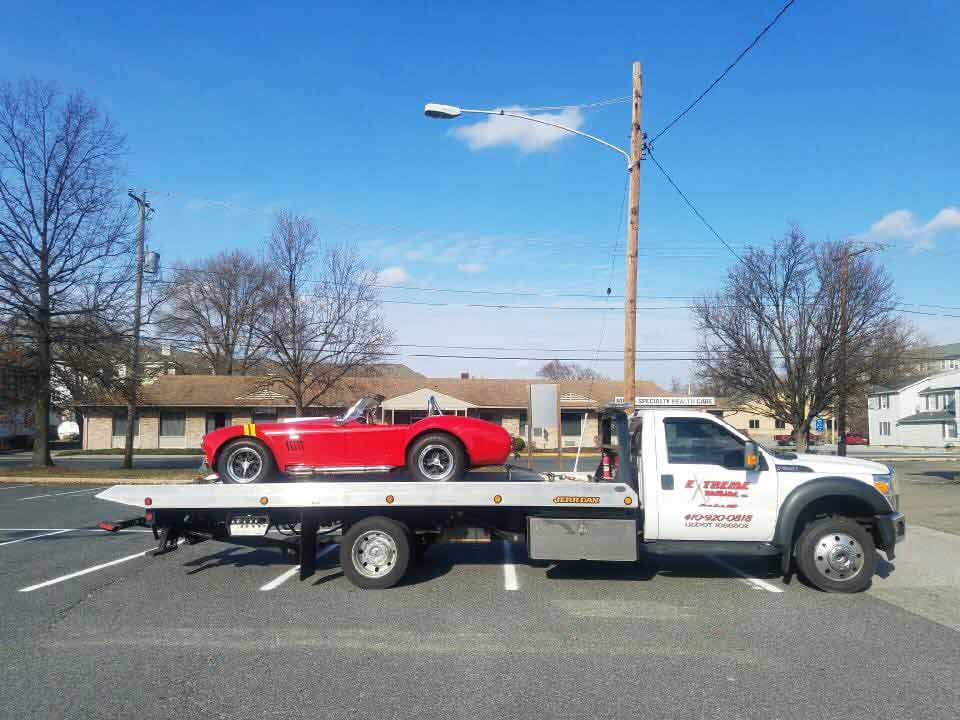 Red Sports Car on Towing Truck | Elkton, MD | Extreme Towing LLC