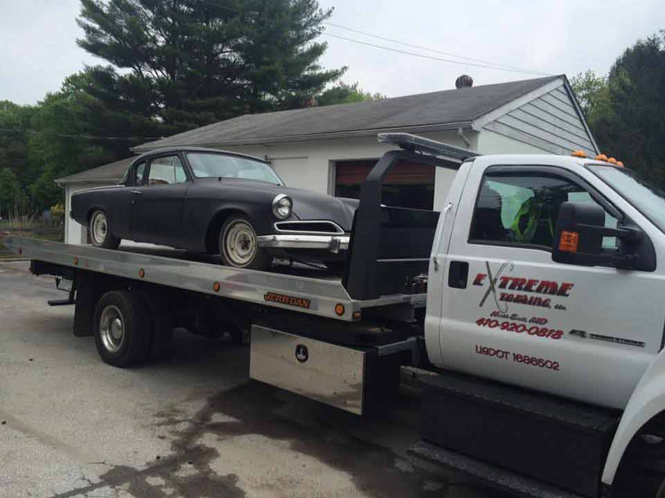 Black Retro Car on Towing Truck | Elkton, MD | Extreme Towing LLC