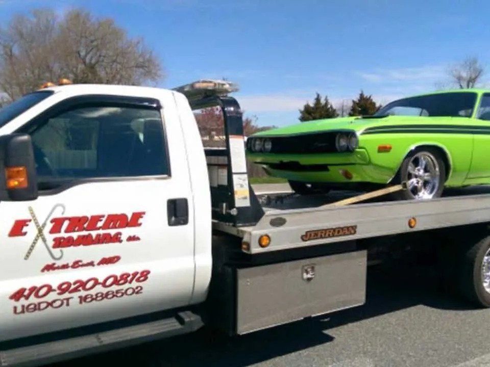 Green Car on Towing Truck | Elkton, MD | Extreme Towing LLC