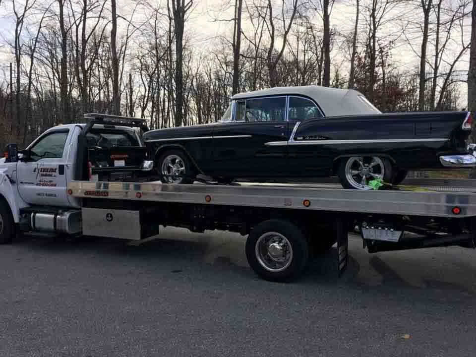 Black Car on Towing Truck | Elkton, MD | Extreme Towing LLC