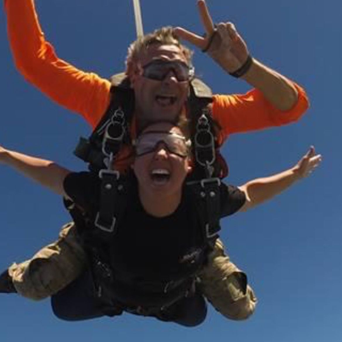 A man and a woman are flying through the air