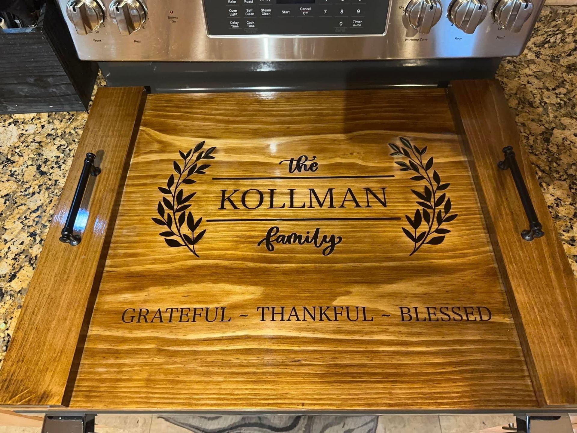 A wooden stove top cover is sitting on top of a stove.