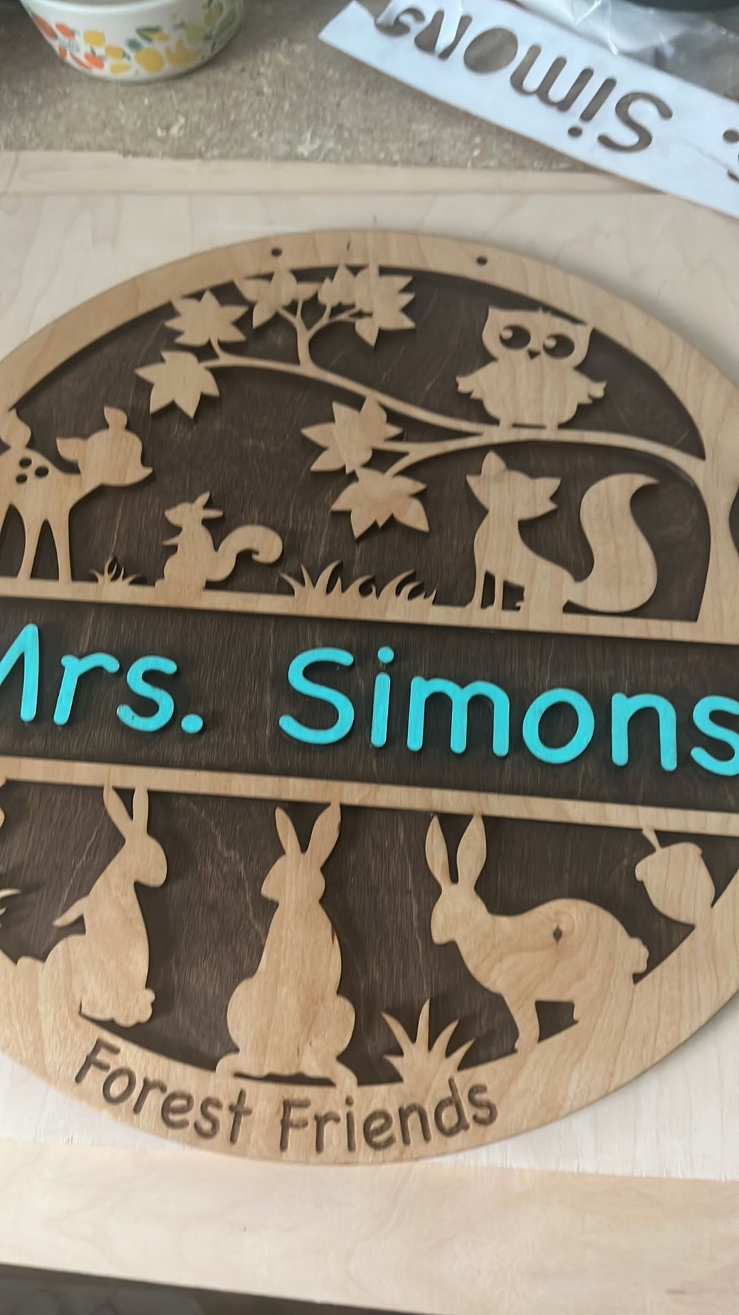 A wooden sign that says mrs. simons forest friends