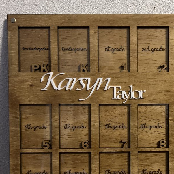 A wooden board with the name karsyn taylor on it