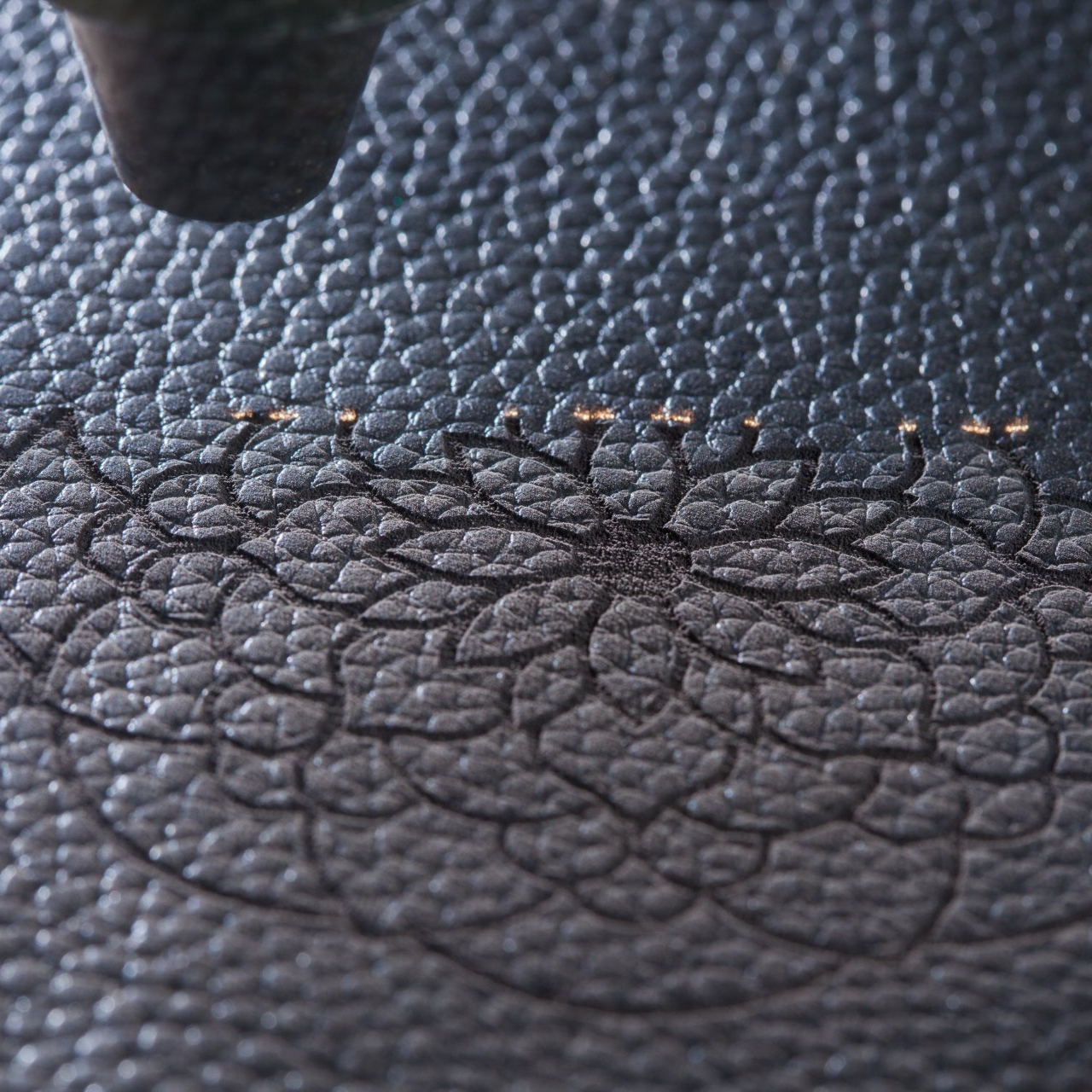 A close up of a piece of black leather