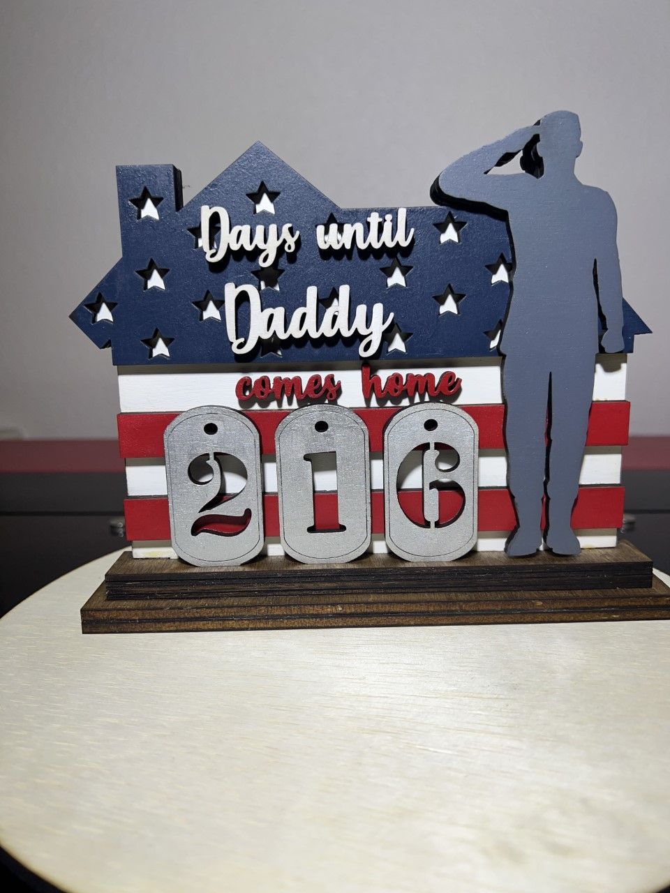 A sign that says ' days until daddy ' on it